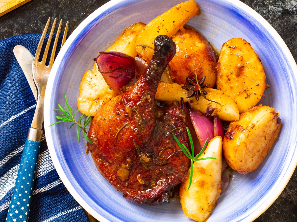 BAKED DUCK LEGS WITH POTATOES, ONIONS, AND PEARS