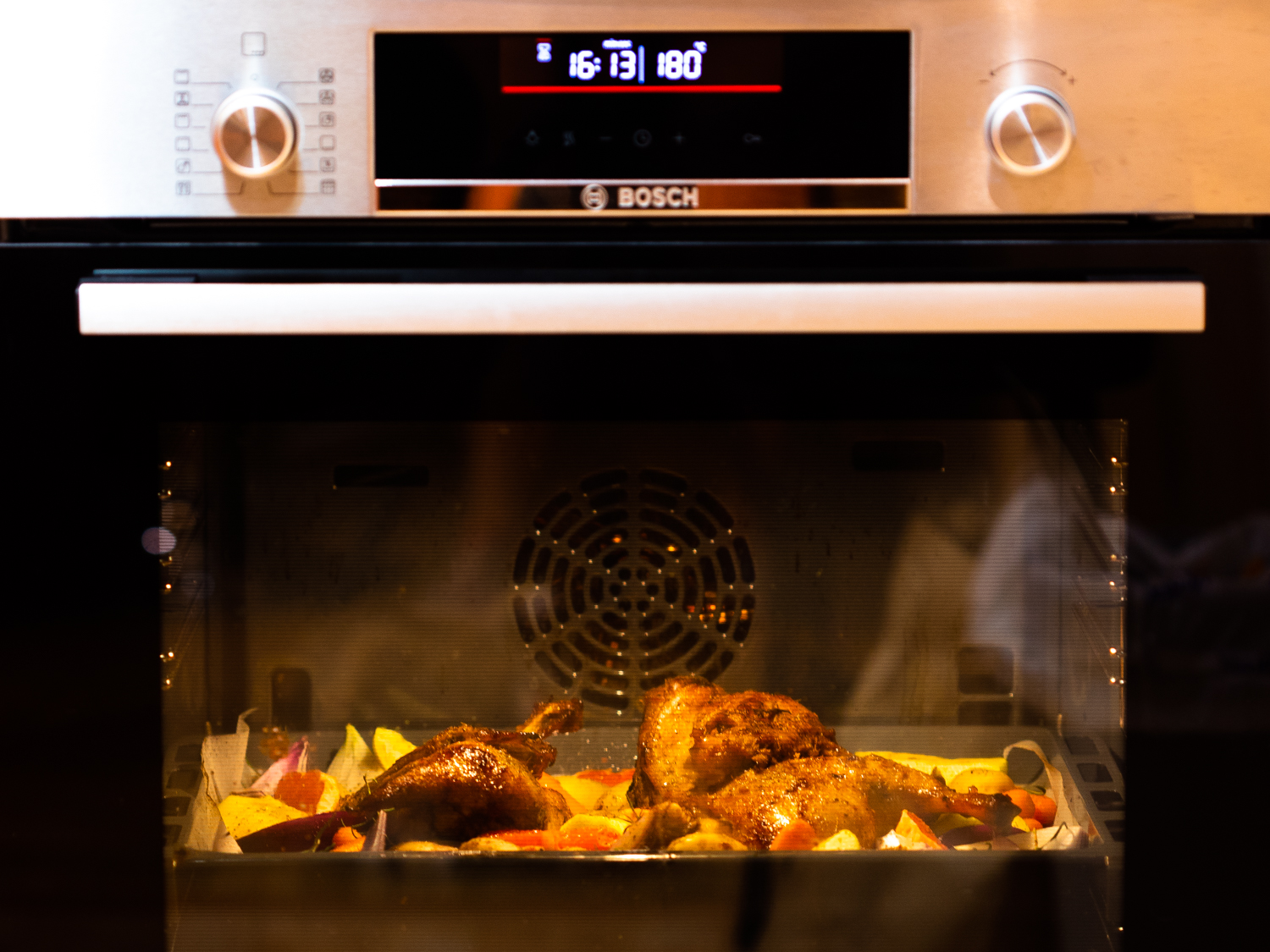 Christmas duck baked with apples, grapefruit, and potato